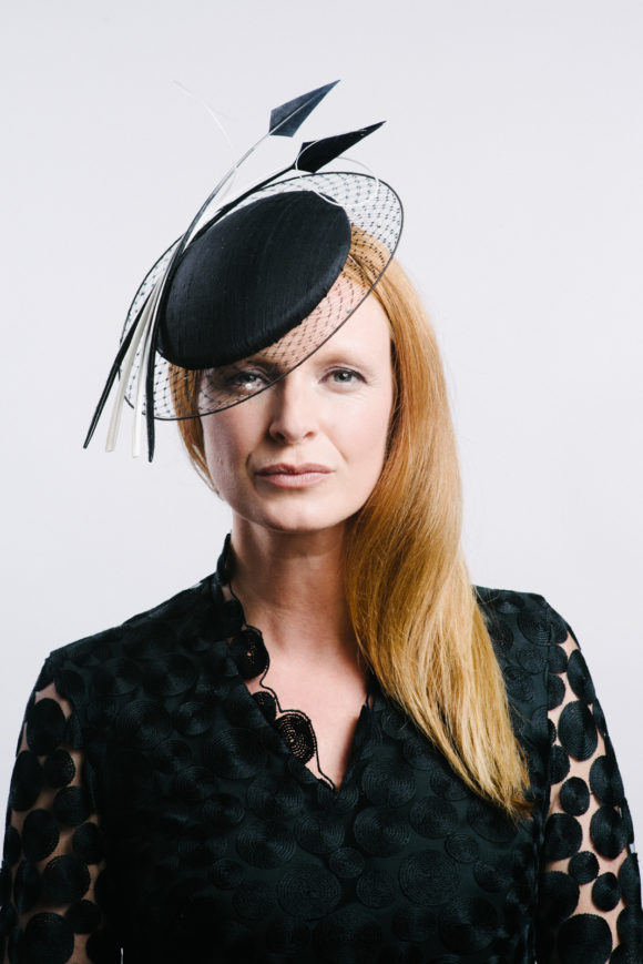 Black silk button with veil halo and feathers